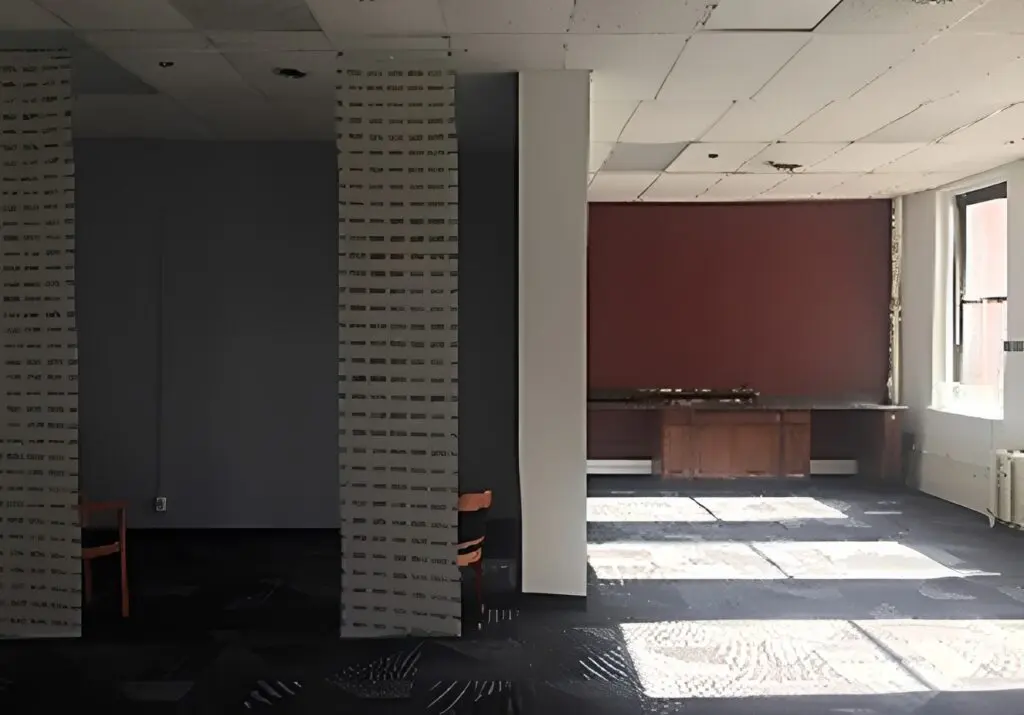 Abandoned office space with sunlit floor
