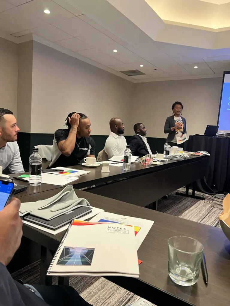 Attendees at a business seminar with notes
