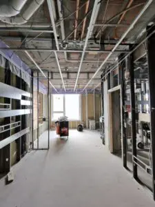 Construction site interior with exposed ceiling and walls