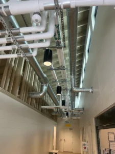 Modern building interior with exposed utilities
